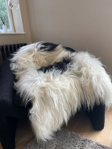 A decorative  whilte genuine soft luxury sheepskin rug