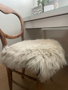 Beige/nude sheepskin chair cover/seat pad